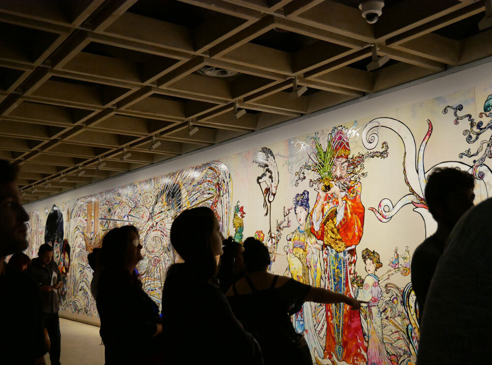 Visitors viewing Takashi Murakami’s painting